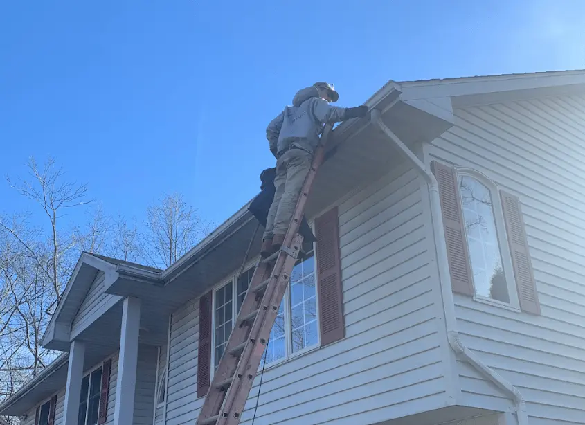 Gutter cleaning and maintenance being performed by Macedonia Power Washing in Macedonia
